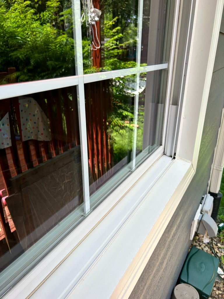 Same window with clean glass and frame after Grand Glass Co service